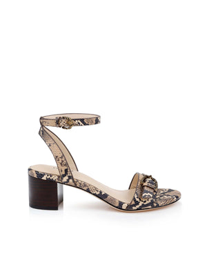 The Hughette Leather Sandal is a single women's statement shoe with a chunky block heel, ankle strap with decorative buckle, open toe, and beige and black snake print leather.