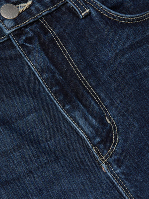 Close-up of the Mira Cropped Bootcut Jean by L'AGENCE in blue stretch denim, featuring a front pocket, metal button, visible yellow stitching, and a slightly worn texture with subtle creases and fading.