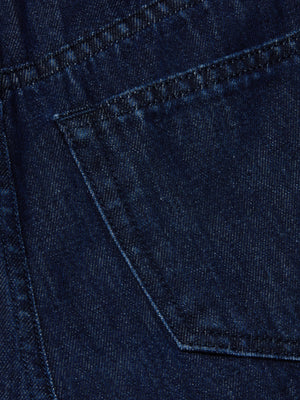 Close-up of the back pocket on the Pacey Wide-Leg Jean, showcasing the visible stitching and rich texture of its dark wash, high-rise denim fabric.