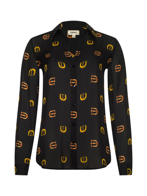 The Nina Silk Blouse by L'AGENCE is a long-sleeved black button-down with yellow and orange geometric patterns, shown on a plain white background.