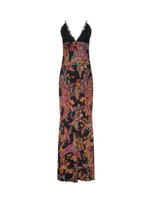 The Susanna Silk Lace Gown by L'AGENCE is a long, sleeveless black dress with vibrant paisley print and a V-neckline trimmed in black lace, shown on a white background.