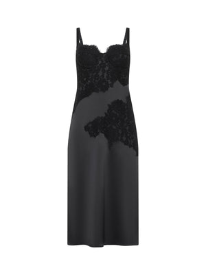 The Fenna Silk Lace Dress by L'AGENCE is a black charmeuse dress with a bustier top, elegant floral lace bodice, and diagonal lace accents on the skirt, shown on a white background.
