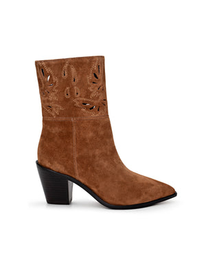 The Anne Western Bootie features brown suede, a pointed toe, black angled heel, and decorative cutout patterns on the upper shaft—perfect for adding classic Western style to any outfit.