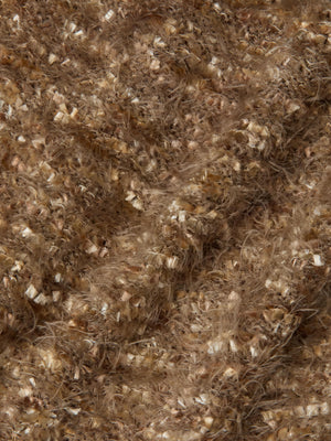 Close-up of textured brown fabric with beige and tan flecks, featuring smooth and fuzzy fibers—perfect as fringe trim or for an eyelash knit on the L'AGENCE Azure Fringe Cardigan Blazer.